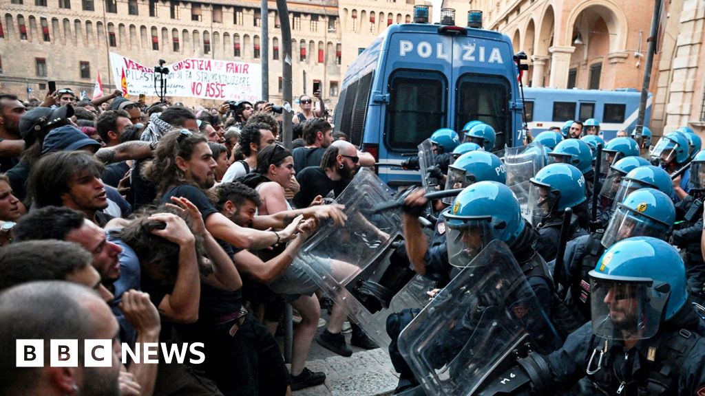 Italy protests: Dozens hurt in Bologna after man dies while being restrained by police